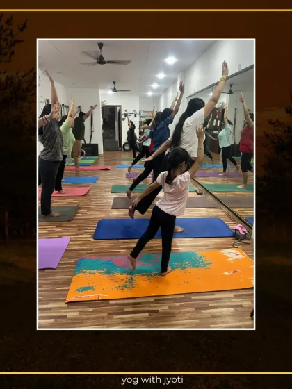 A young student gracefully holds Natarajasana, showing great focus and stability.