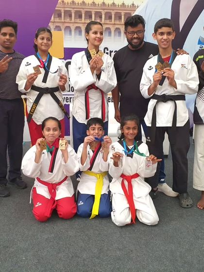 Another shot of our proud medal winners. The smiles on their faces make all the hard work worthwhile.