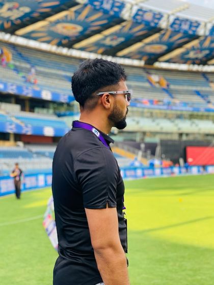 Purpose fuels passion. A side profile shot on the field, focused and ready for the day's work. My purpose is to help athletes achieve their dreams.