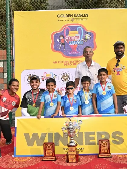 The complete Under 7 winning team with their coaches and the Chote Ustad Trophy. A proud moment for the players, coaches, and parents.