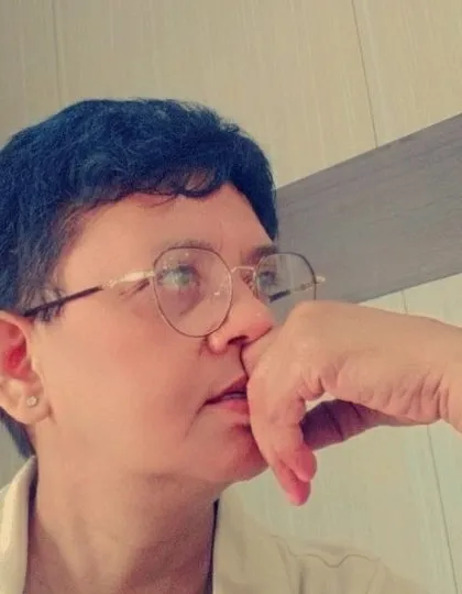 In deep thought. Sometimes the rules for international documents can be tricky, and it requires careful consideration to find the right solution.