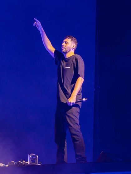 Another shot of Dimitri Vegas, capturing his focus as he addresses the crowd.