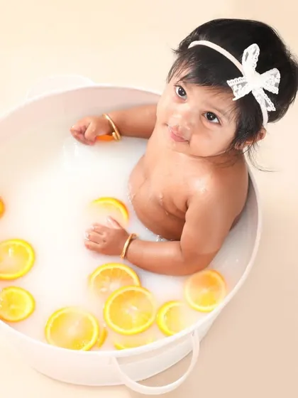 Splish, splash, a baby in a milk bath! These sessions are so much fun and bring out the sweetest, most curious expressions. Look at this little cutie enjoying the warm citrus bath.