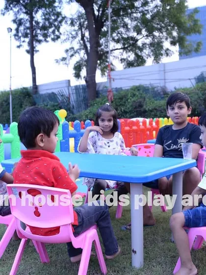 Children enjoying their own dedicated space at an outdoor party. Our colorful tables and chairs are the perfect size for kids to sit together comfortably for snacks and conversation.