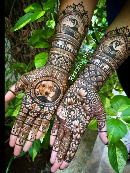 Mehndi is about what's in your heart, and for this bride, that was her beloved pet, Bruno. I was so honored to create this unique engagement design featuring a detailed portrait of her dog, surrounded by traditional lotus and peacock motifs.
