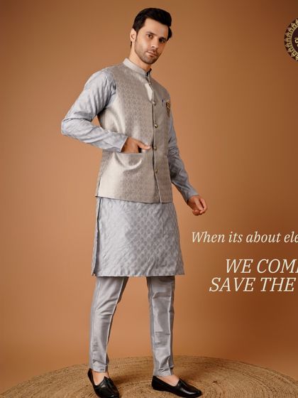 When it's about elegance, we come to save the day. A light grey patterned kurta and Nehru jacket set, a perfect example of subtle sophistication.