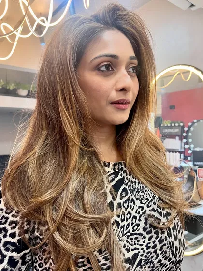 A stunning hair color makeover for model Satarupa Pyne. We went for a warm, honey-blonde balayage that adds incredible dimension and shine to her long layers.