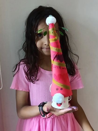 Another creative Santa Gnome, this one with unique leafy decorations, made by a proud young crafter.