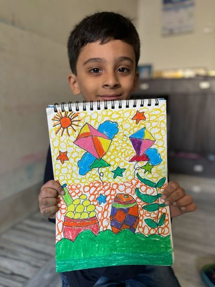 This vibrant Makar Sankranti drawing by a young student is full of colour and festive symbols like kites and stars. I encourage kids to fill their pages with joy.