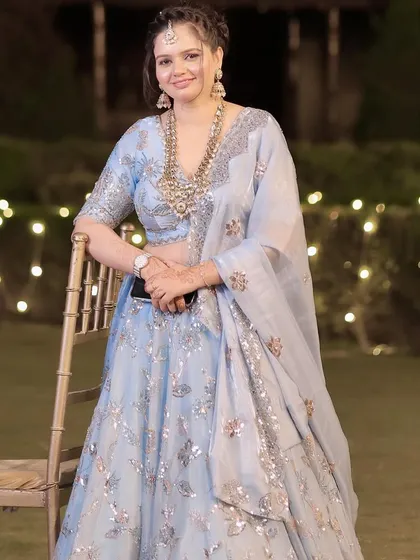 A candid moment at an evening party. The makeup glows beautifully under the lights.