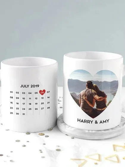 This customized photo mug features a calendar on one side with your special date marked, and your photo and names in a heart on the other side.