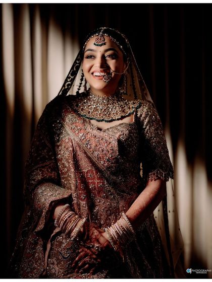 A collection of professional shots of my bride Shachi. Her dusty rose lehenga with a long trail was pure magic. We did a soft glam look with a subtle smokey eye to match the grandeur.