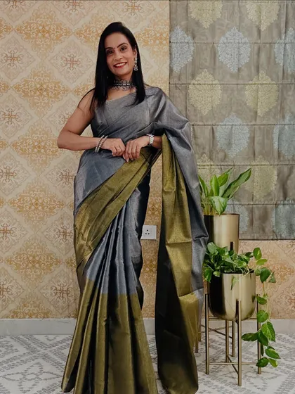 This grey and olive green soft tissue saree is a beautiful and affordable find from Meesho. The subtle shine of the tissue fabric gives it a festive look.