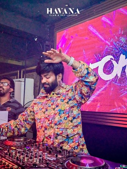 In a colorful jacket, working the mixer at Havana, Bhubaneswar.