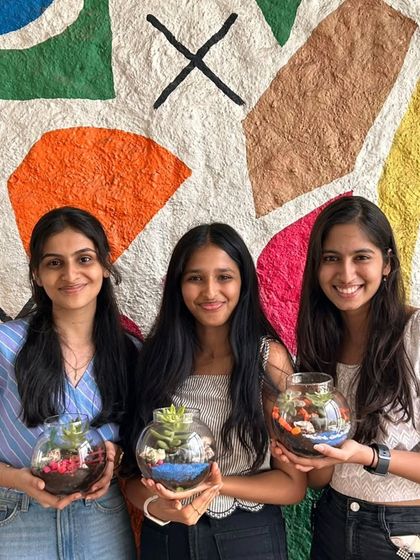 Three happy creators with their beautiful terrariums. They each built a small world to take home with them.