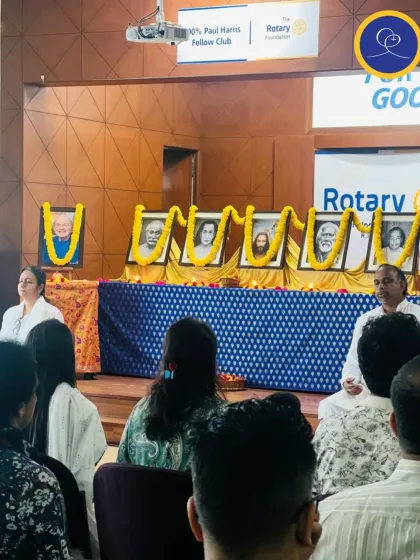 A view from the back of our Sunday Satsang at the Rotary Club. The altar with our line of masters is the focal point, radiating blessings to all who attend.