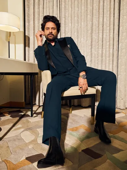 Jaideep Ahlawat styled for IIFA in a deep teal suit by Raamz Label. The satin lapels and a unique crocodile pocket clip from Tichu Official elevate this classic tuxedo look.