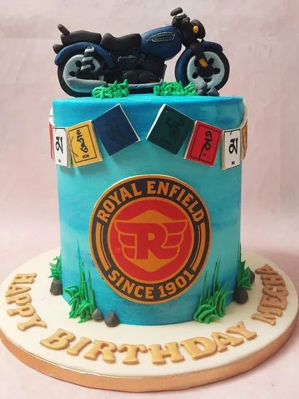 The intricate details, from the bike to the prayer flags, make this a truly special and personalized cake.