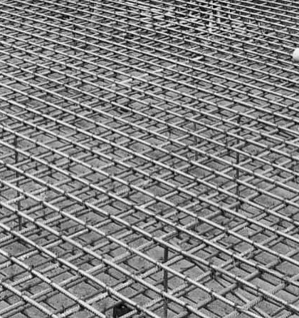 A close-up of the dense steel mesh for a foundation raft. The sheer expanse and repetitive pattern have a beauty of their own.