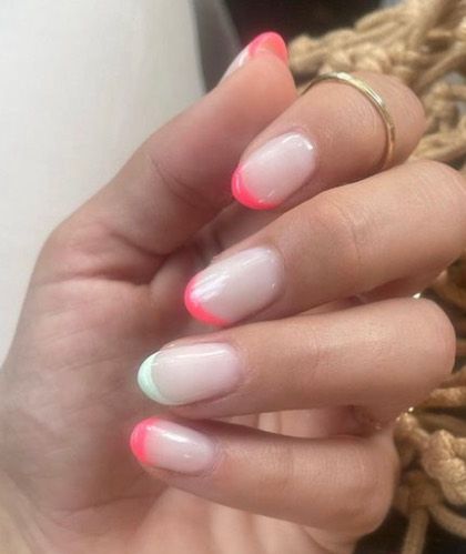 A fun, mismatched French manicure with neon pink and mint green tips. This is a great way to play with color while keeping the design simple and chic.