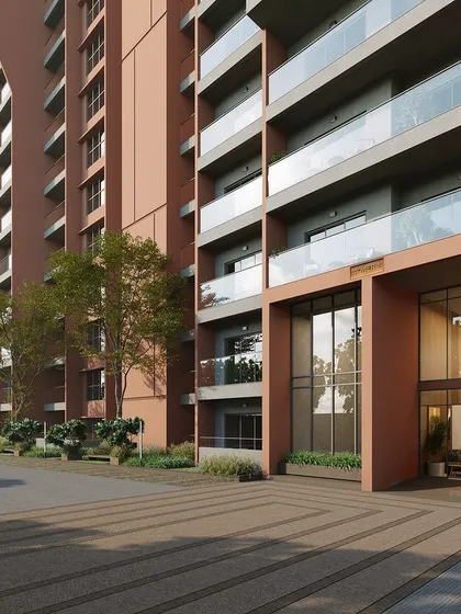 The entrance detail of a high-rise apartment building, where we used a combination of glass, textured concrete, and integrated planters to create a welcoming and modern arrival experience.