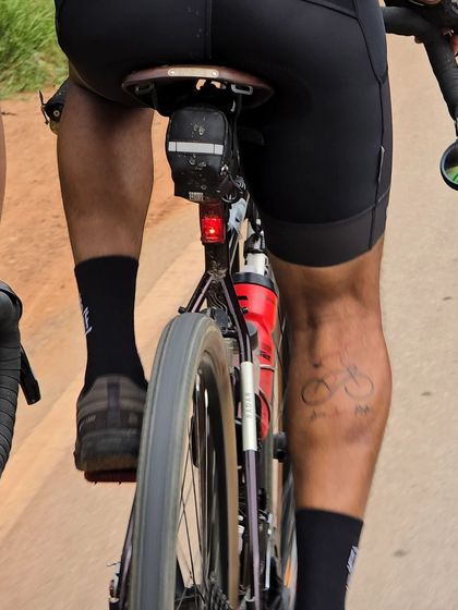 A creative shot of a rider's leg tattoo, perfectly capturing the love for cycling during the Rajyotsava 200K.