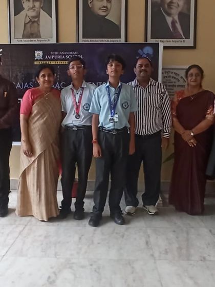 Aadi with his family and teachers after his Astrofest victory. This achievement, securing 3rd position across Kanpur, is a proud moment for our entire community.