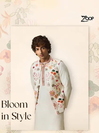 Bloom in style with this floral embroidered jacket. This piece captures nature's beauty in every thread, offering a fresh and modern take on classic menswear for festive occasions.