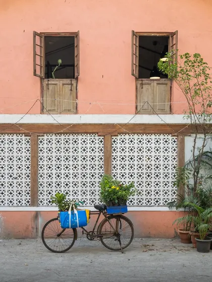 The exterior of my studio tells a story of revival. The salmon-pink facade, traditional jaali work, and classic wooden windows were carefully restored to honor the building's original character. It stands as a quiet reminder that with patience and love, forgotten spaces can find their purpose again.
