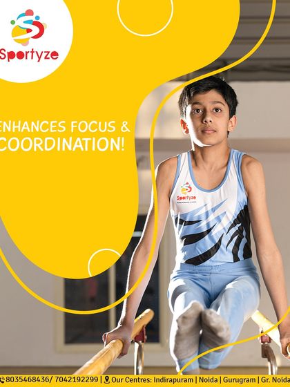 Gymnastics enhances focus and coordination. This young athlete shows intense concentration while performing on the parallel bars, a key piece of equipment for developing upper body strength.