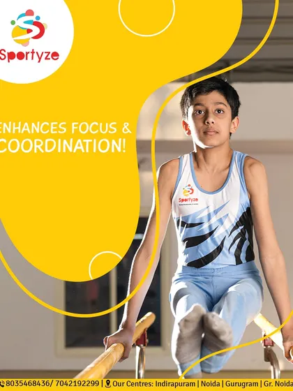 Gymnastics enhances focus and coordination. This young athlete shows intense concentration while performing on the parallel bars, a key piece of equipment for developing upper body strength.