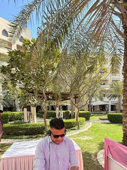 Setting up for a garden party in Bahrain. The lush greenery and beautiful architecture of the hotel provided a stunning backdrop.