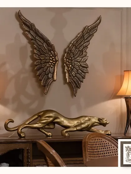 I love creating dramatic and inspiring spaces. This composition, featuring a golden panther sculpture poised beneath a pair of magnificent metal angel wings, is designed to be a powerful and meaningful statement piece that symbolizes freedom and strength.
