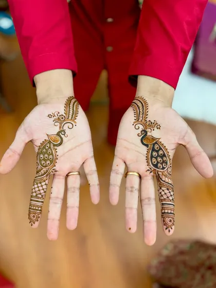 Mehendi isn't just for brides. I also create stylish and symbolic designs for grooms, like these matching peacocks. It's a wonderful way for the groom to participate in the tradition and get some great photos.