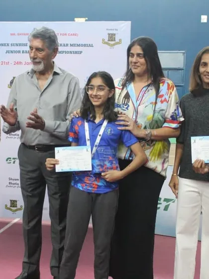 Winners of a junior category stand proudly with their certificates and our leadership team. We ensure every achievement, big or small, is celebrated.