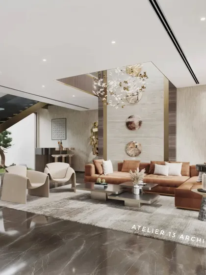 A wide view of a farmhouse family lounge, showing how the space connects to the outdoors. The design incorporates a large L-shaped sofa, modern Italian chairs, and a double-height ceiling with a crystal chandelier to create an open, airy atmosphere.