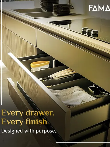 Every drawer, every finish, is designed with purpose. Here, a drawer is fitted with custom organizers for cutlery and linens, ensuring everything has its place. The textured drawer front adds a layer of visual interest to the practical design.