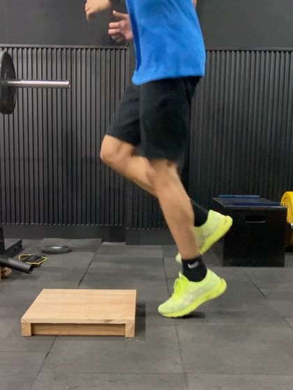 An athlete performing a lateral box jump. This drill develops frontal plane power and stability, which is critical for side-to-side movements like shuffling in the field or adjusting at the crease.
