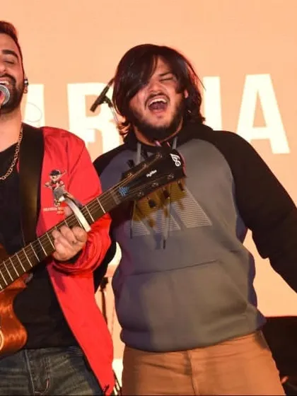 Jamming on stage with Bollywood singer Rajiv Raja. We love creating an energetic and engaging atmosphere at our events.