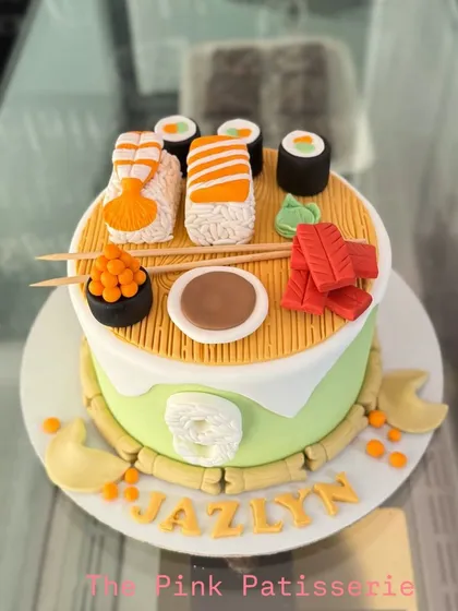 A top-down view of the amazing sushi cake, showing the realistic details of the fondant creations.