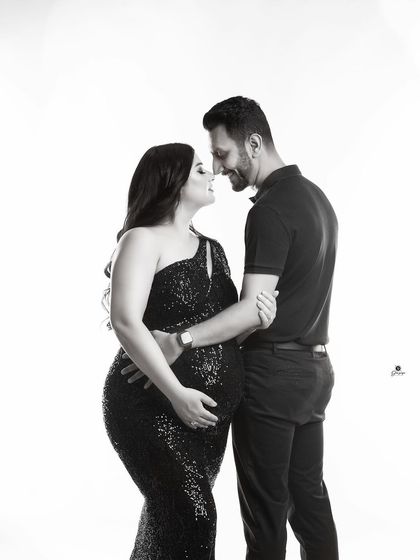 An intimate black and white couple portrait. The close-up on their happy, connected expressions makes this a powerful and emotional image.