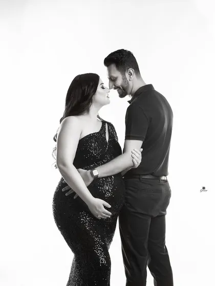 An intimate black and white couple portrait. The close-up on their happy, connected expressions makes this a powerful and emotional image.