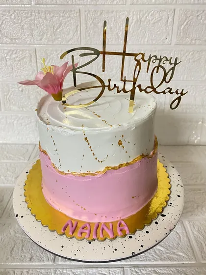 Another shot of our elegant pink and white cake, perfect for a sophisticated celebration.