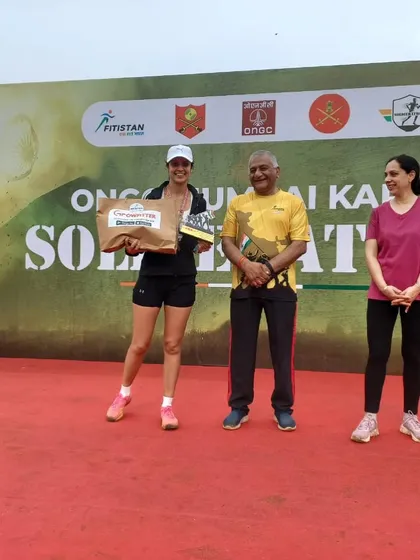 Accepting a podium prize at the Soldierathon. Every race is a battle, and finishing strong, especially after overcoming challenges, is a victory in itself.
