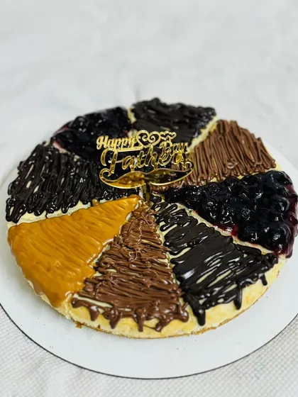 A special Father's Day cheesecake featuring an assortment of delicious toppings.
