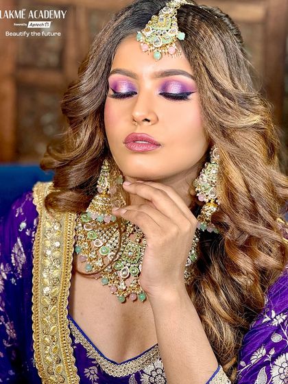 A closer look at the dramatic purple eye makeup. Our advanced classes focus on blending techniques that allow for intense color payoff while maintaining a smooth, professional finish, perfect for evening events.