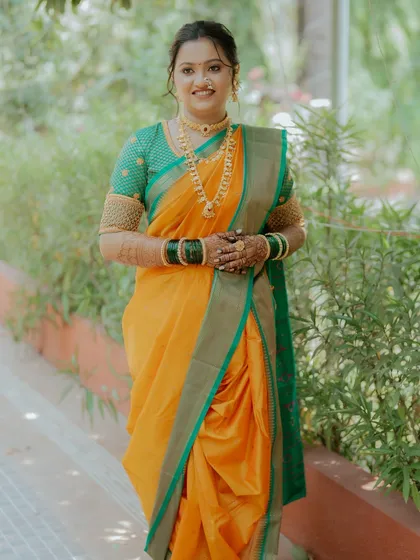The elegance of a Nauvari saree is unmatched. I styled this bride with a traditional drape and a makeup look that enhanced her natural grace and beauty.