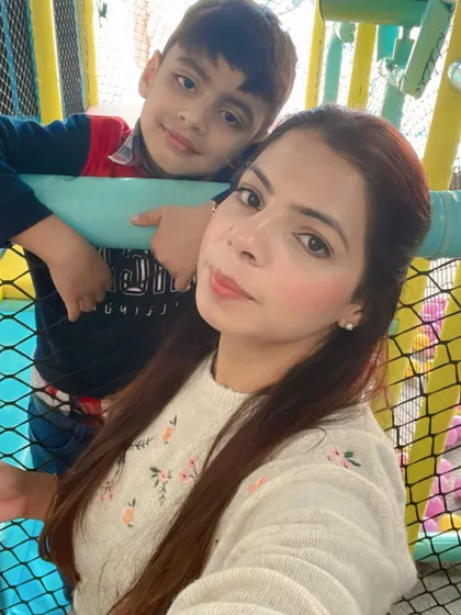 A mother and son take a quick break from playing. The safety netting and open design mean you're never far from the fun.