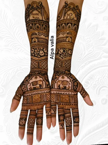 The front view of the travel-themed bridal mehendi, showing the palms. The design includes elephant motifs and lotus details.