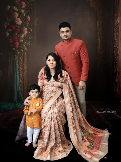 Celebrating new life with tradition and grace. This family maternity portrait, with everyone in coordinated Indian attire, is a beautiful way to honor your heritage while anticipating your new arrival.